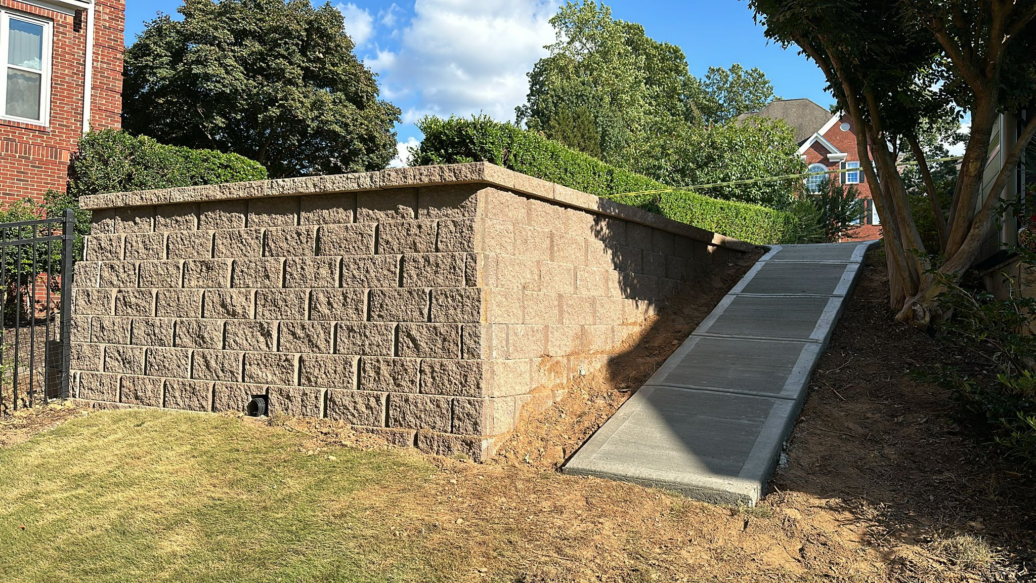 Structural block and concrete retaining walls built for erosion control