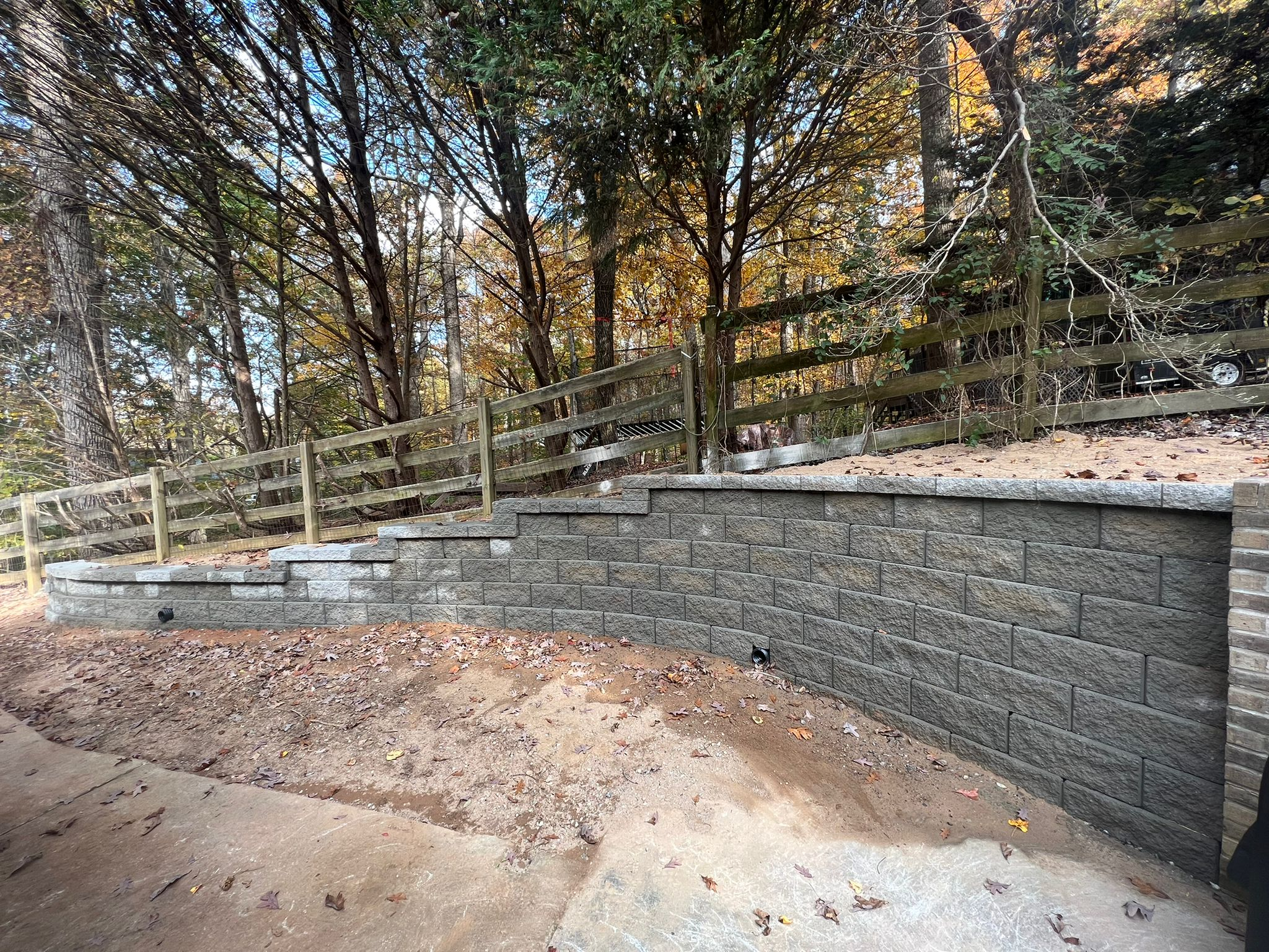 Retaining wall construction with proper drainage backfill