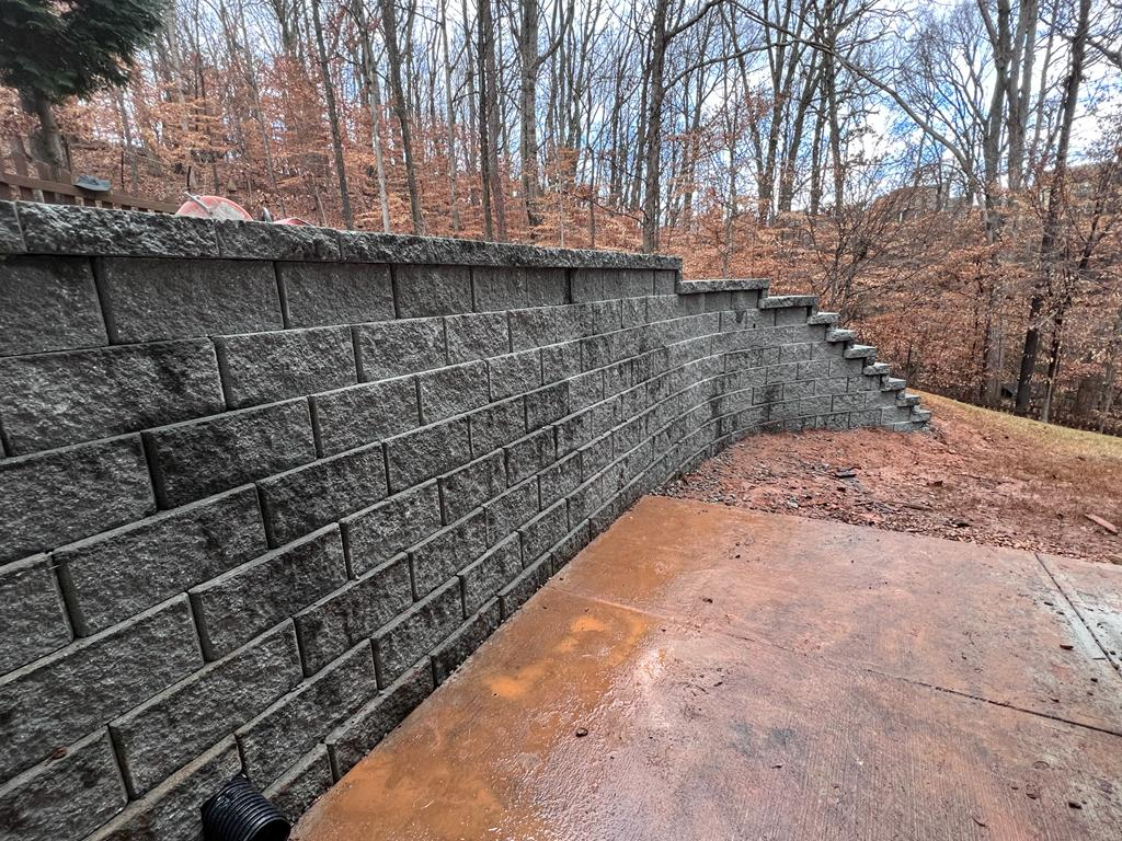 Completed retaining wall and landscape drainage project